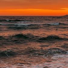 Sunset on Wavy water